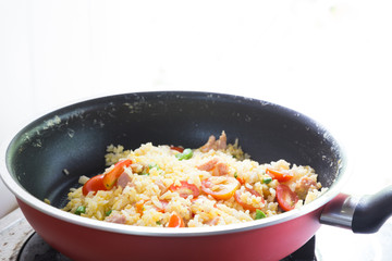 Cooking fried rice in pan