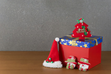 gift box and christmas hat on wood table