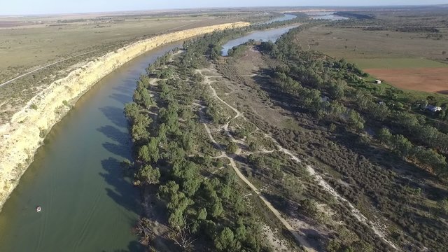 Aerial video footage of river murray cliffs at big bend near nildottie featuring great tourism holidays with jet ski and water ski boat