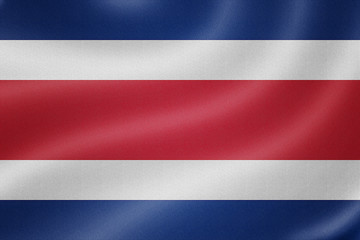 Fototapeta premium CostaRica flag on the fabric texture background