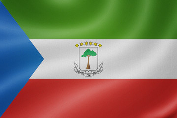 Equatorial Guinea flag on the fabric texture background