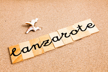 Words formed from small pieces of wood containing a sun and beach tourist destination, Lanzarote