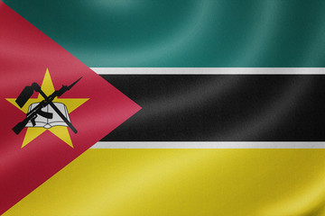 Mozambique flag on the fabric texture background