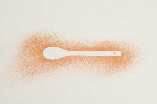 Pattern made tablespoons cocoa spilled.