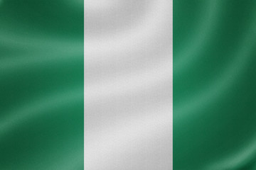Obraz premium Nigeria flag on the fabric texture background