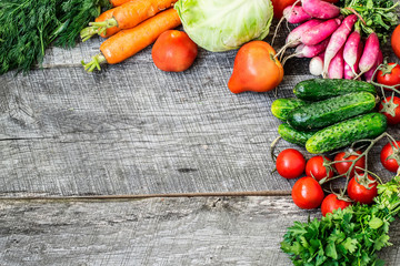 Sets with organic vegetables on a wooden background.Copy space b