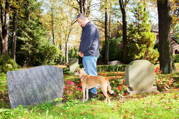 Man and dog in the cemetery