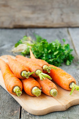 Organic carrots on a wooden background