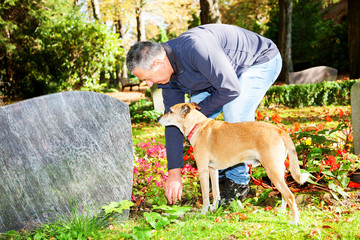 Man and dog in the cemetery