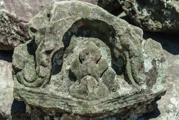 bas-reliefs in the remains of a prasat in the archaeological place of angkor wat in siam reap, cambodia