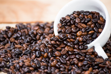 Coffee beans in coffee cup