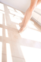 Ballerina in Ballet Slippers on Toes in Studio © Flamingo Images