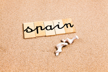 Words formed from small pieces of wood containing a sun and beach tourist destination, Spain