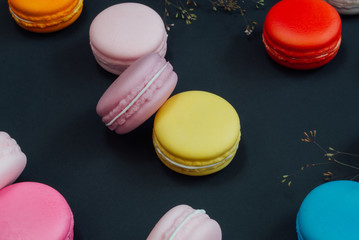 Macaron in a wooden box on black, Vintage tone
