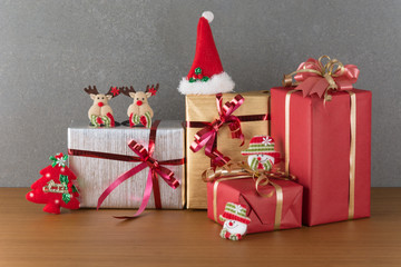 gift box and christmas hat on wood table