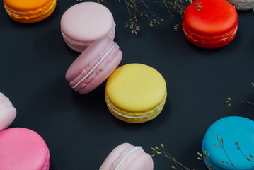 Macaron in a wooden box on black, Vintage tone