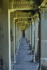 sight in perspective of a gallery and pillars in the archaeological place of angkor wat in siam reap, cambodia