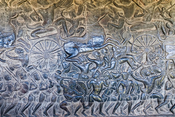 bas-reliefs representing the kurukshetra battle in the archaeological place of angkor wat in siam...