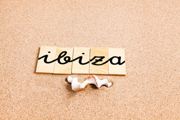 Words formed from small pieces of wood containing a sun and beach tourist destination, Ibiza