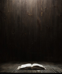 dark wooden background texture. Wood shelf, grunge industrial interior with a book