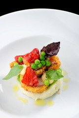 Fine dining, Fried Octopus on potato purree, green peas and fresh strawberries