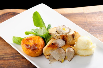 Fine dining mail course, grilled chicken breast with black truffles, quiche and potato purree