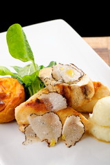 Fine dining mail course, grilled chicken breast with black truffles, quiche and potato purree
