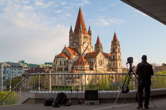 A man captures St. Francis of Assisi Church on large format camera.