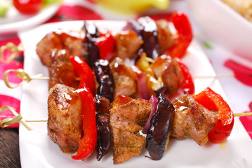 meat and vegetable skewers with teriyaki sauce