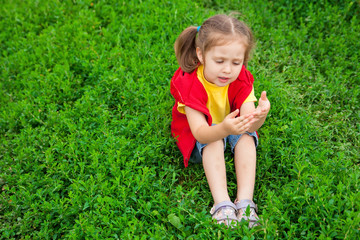 Little girl in meadow