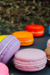 Macaron in a wooden box on black, Vintage tone