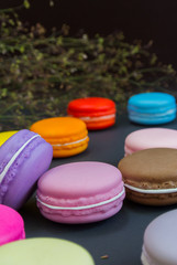Macaron in a wooden box on black, Vintage tone
