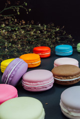 Macaron in a wooden box on black, Vintage tone