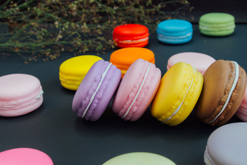 Macaron in a wooden box on black, Vintage tone