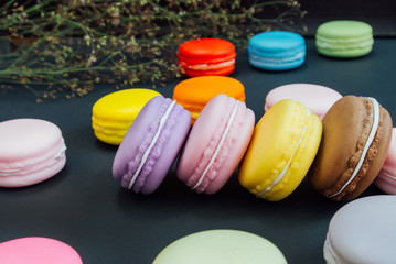 Macaron in a wooden box on black, Vintage tone