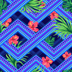 seamless tropical pattern on a tribal background. overlapping geometrical shapes with hibiscus flowers and palm leaves. fashion print
