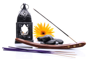 Lantern and incense on a white background