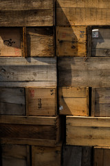Crates stack. weathered wooden boxes background.