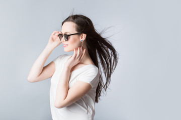 Fototapeta premium Cheerful woman with hair in the wind