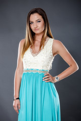 Fototapeta premium young beautiful woman isolated on gray