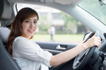 Asian beautiful woman driving car portrait