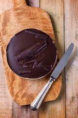 Fresh classic homemade Cheesecake with dark chocolate topping