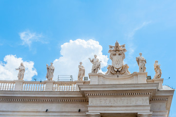 Fototapeta premium View of St Peter square statue up on Bernini's colonnade