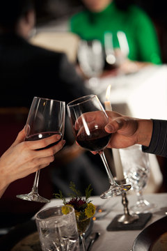 Restaurant: Man and Woman Toast With Wine Glasses