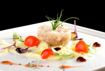 Fine dining, Elegant seabass tartare with potato and pesto topped balsamic sauce