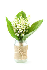 Lily of the Valley in bottle isolated on white