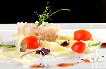 Fine dining, Elegant seabass tartare with potato and pesto topped balsamic sauce