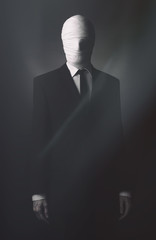 Man wearing costume of Slender Man