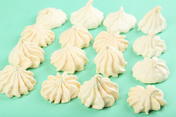 French meringue cookies on green background