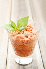 Glass with granita from fresh tomatoes 
